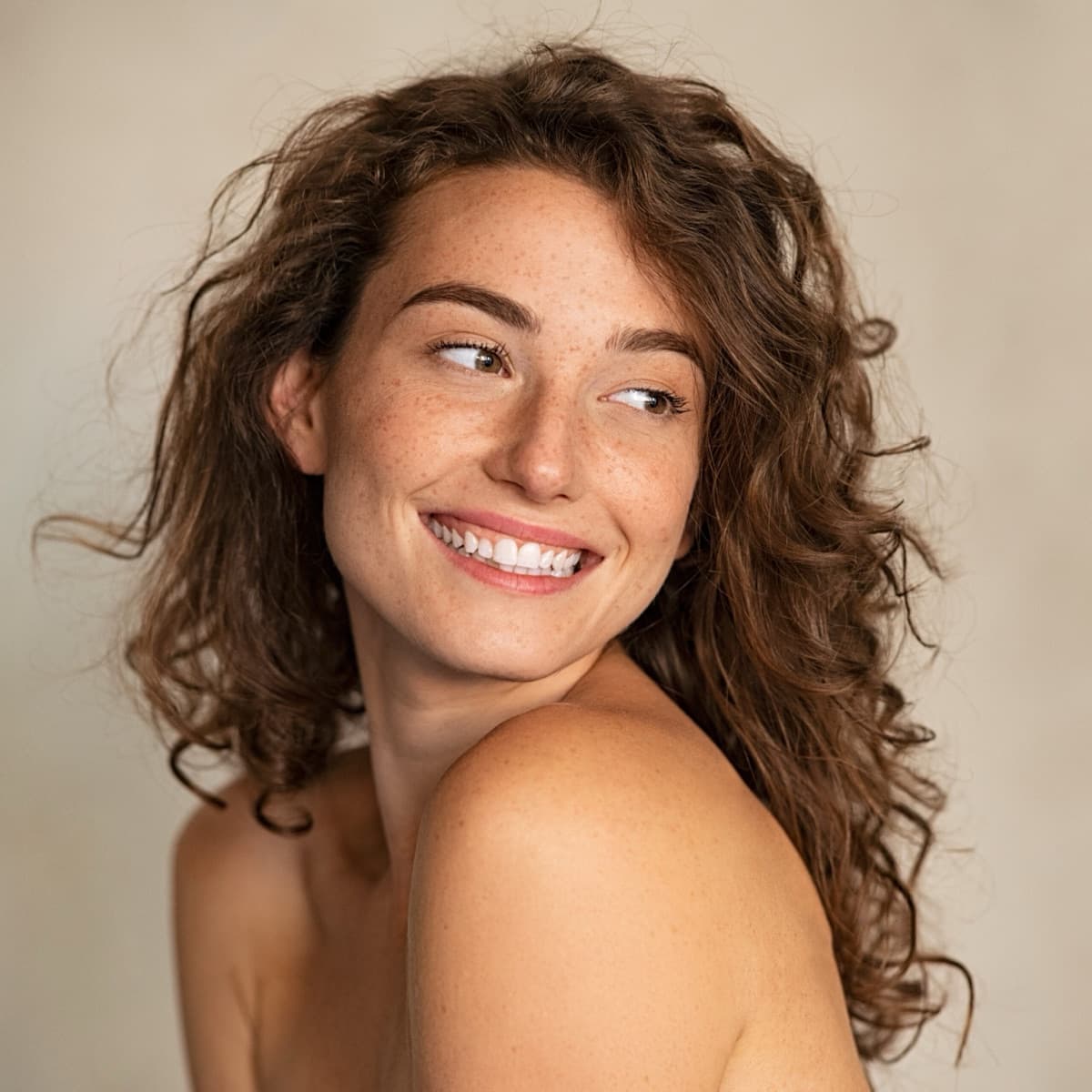 Patient smiling over their shoulder